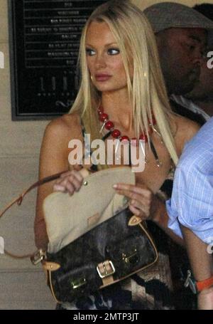 Australian model and actress Sophie Turner pays a valet and poses for photographers as she leaves The London West Hollywood hotel. Los Angeles, CA. 08/28/10. Stock Photo