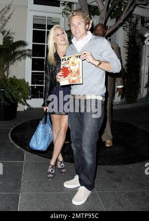 Spencer Pratt celebrates his 26th birthday a day early and got quite the present from wife Heidi Montag. Spencer received an early copy of the September Playboy featuring Heidi's photo spread! The two showed off the magazine topped with a big red bow as they posed for photos outside the restaurant Cut at the Beverly Wilshire Hotel. Los Angeles, CA. 8/14/09. Stock Photo