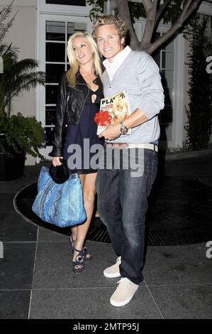 Spencer Pratt celebrates his 26th birthday a day early and got quite the present from wife Heidi Montag. Spencer received an early copy of the September Playboy featuring Heidi's photo spread! The two showed off the magazine topped with a big red bow as they posed for photos outside the restaurant Cut at the Beverly Wilshire Hotel. Los Angeles, CA. 8/14/09. Stock Photo