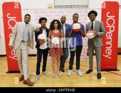 IMAGE DISTRIBUTED FOR JCPENNEY - Dallas Cowboys linebacker Sean Lee, left,  shops alongside Ajion Lair, 18, from the Boys & Girls Club of Greater Dallas  as he selects gifts for his family