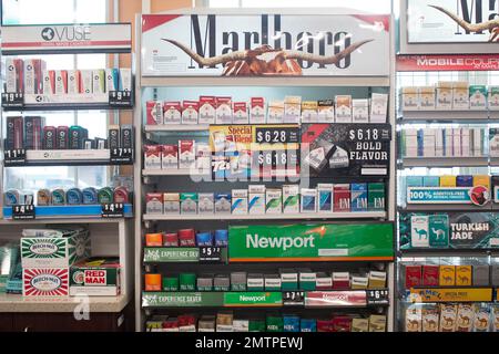 Packs of cigarettes are offered for sale at a convenience store in Helena,  Mont., on Thursday, May 18, 2017. The nation's two largest tobacco  companies spent a combined $147,000 through the first