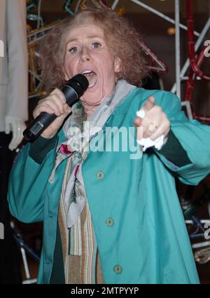 Catherine Tate performs as the character Joannie 'Nan' Taylor, who she plays on her comedy program 'The Catherine Tate Show,' as she lights the Christmas lights at the Stella McCartney store. London, UK. 11/22/10. Stock Photo