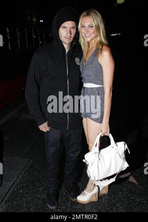 Stephanie Pratt shows off her long, slim legs as she leaves the restaurant Katsuya with boyfriend, motocross star Josh Hansen. Los Angeles, CA. 7/27/10. Stock Photo