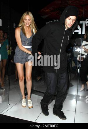 Stephanie Pratt shows off her long, slim legs as she leaves the restaurant Katsuya with boyfriend, motocross star Josh Hansen. Los Angeles, CA. 7/27/10. Stock Photo