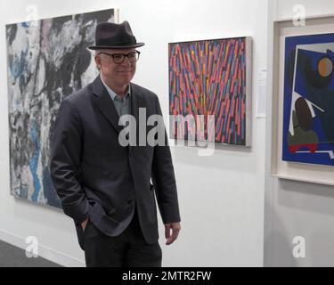 Actor, comedian and musician Steve Martin poses for photos while browsing exhibits at Art Basel Miami Beach with his wife Anne Stringfield. Miami Beach, FL. 12/2/10. Stock Photo