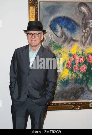 Actor, comedian and musician Steve Martin poses for photos while browsing exhibits at Art Basel Miami Beach with his wife Anne Stringfield. Miami Beach, FL. 12/2/10. Stock Photo