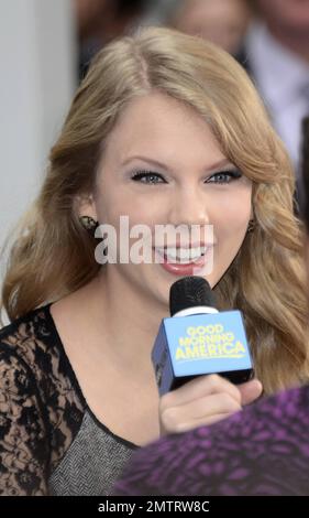 Country star Taylor Swift greeted her loving fans outside ABC's 'Good Morning America' in Times Square. Swift was recently announced as Billboard's Woman of the Year and at 21-years of age is the youngest to ever receive that honor. It's been a great week for Taylor as she also debut her new fragrance 'Wonderstruck' at Macy's Herald Square. New York, NY. 13th October 2011.   . Stock Photo