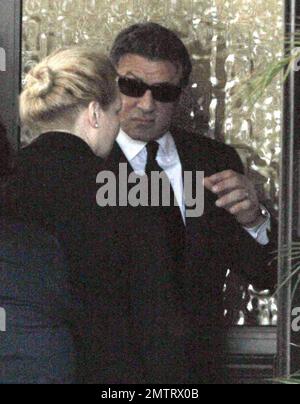 Sylvester Stallone arrives at his son Sage Stallone's funeral. Wearing a black suit and shades to hide his eyes, the actor made his way into the St. Martin of Tours Catholic Church. Sage was found dead at his LA home on the 13th July, the cause of death is yet to be confirmed. Brentwood, CA, 21st of July, 2012. Stock Photo
