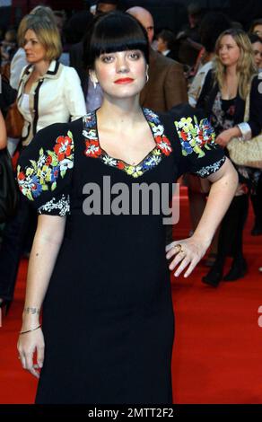 Pregnant with her first child and showing a bit of a baby bump underneath her long black and floral printed dress Lily Allen walks the red carpet at the premiere of Tamara Drewe benefiting the Prince ...