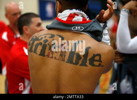 Maryland s Melo Trimble reverses his jersey and exposes a tattoo of his last name with a Maryland themed M as he participates at the NBA draft basketball combine Thursday May 11 2017