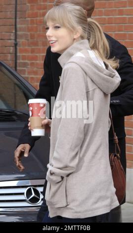 Country sensation Taylor Swift was seen leaving her London hotel in a grey wool jacket, blue skinny jeans, a brown purse and two-toned Oxford shoes. 22 year old songstress is in town to meet with producers about her upcoming role in the film adaptation of 'Les Miserables.' London, UK. 23rd January 2012. Stock Photo