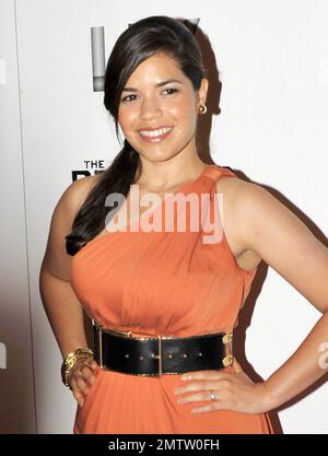 Clad in a flattering orange cocktail dress and wide belt, actress America Ferrera arrives at the Colony Theater on Lincoln Road for a red carpet screening of 'The Dry Land' directed by Ryan Piers Williams, starring America Ferrera and Wilmer Valderrama.  At the theatre the trio of stars appeared to be having a great time as they posed on the red carpet and chatted with each other and some friends. An after party followed at LIV nightclub at Fontainebleau Miami Beach, featuring DJ Rony Seikaly. Miami Beach, FL. 08/21/10. Stock Photo