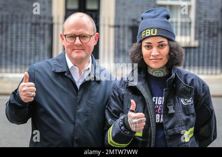 London, UK. 01st Feb, 2023. Kasey LeGall (Fire Brigades Union, right), Paul Nowak (General Secretary TUC, left), in Downing Street. Union representatives of the TUC, Unison and Fire Brigades Union hand over a petition at 10 Downing Street today, following the large TUC march through London earlier. Kasey LeGall (Fire Brigades Union), Paul Nowak (General Secretary TUC), Kate Bell (Assistant General Secretary TUC) and Eddie Brand ( Branch Secretary of the London Ambulance Service within Unison) handed over the petition. Credit: Imageplotter/Alamy Live News Stock Photo