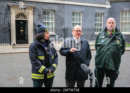 London, UK. 01st Feb, 2023. Kasey LeGall (Fire Brigades Union, left), Paul Nowak (General Secretary TUC, middle), Eddie Brand (right) in Downing Street. Union representatives of the TUC, Unison and Fire Brigades Union hand over a petition at 10 Downing Street today, following the large TUC march through London earlier. Kasey LeGall (Fire Brigades Union), Paul Nowak (General Secretary TUC), Kate Bell (Assistant General Secretary TUC) and Eddie Brand ( Branch Secretary of the London Ambulance Service within Unison) handed over the petition. Credit: Imageplotter/Alamy Live News Stock Photo