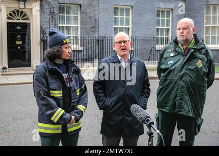 London, UK. 01st Feb, 2023. Kasey LeGall (Fire Brigades Union, left), Paul Nowak (General Secretary TUC, middle), Eddie Brand (right) in Downing Street. Union representatives of the TUC, Unison and Fire Brigades Union hand over a petition at 10 Downing Street today, following the large TUC march through London earlier. Kasey LeGall (Fire Brigades Union), Paul Nowak (General Secretary TUC), Kate Bell (Assistant General Secretary TUC) and Eddie Brand ( Branch Secretary of the London Ambulance Service within Unison) handed over the petition. Credit: Imageplotter/Alamy Live News Stock Photo