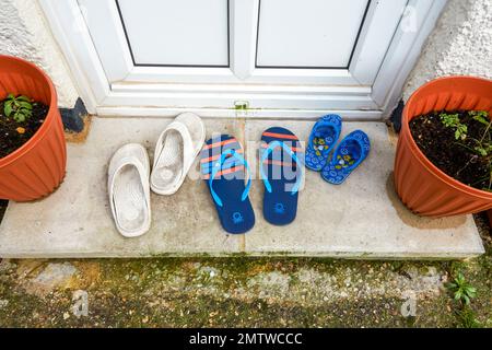 Flip flop sandals on a doorstep Stock Photo