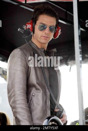 Actor Tom Cruise climbs into Jeff Gordon's pit box where he watches the Daytona 500 with son Connor after driving the pace car to start the race in Daytona Beach, FL. 2/15/09. Stock Photo