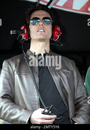 Actor Tom Cruise climbs into Jeff Gordon's pit box where he watches the Daytona 500 with son Connor after driving the pace car to start the race in Daytona Beach, FL. 2/15/09. Stock Photo