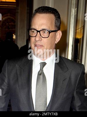 Actor Tom Hanks looks dapper in a black suit as he leaves his luxury hotel. Hanks did his best to keep a low profile as he left, turning away from autograph seekers and photographers. London, UK. 6/6/11. Stock Photo