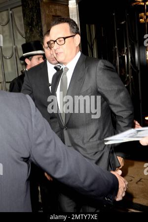 Actor Tom Hanks looks dapper in a black suit as he leaves his luxury hotel. Hanks did his best to keep a low profile as he left, turning away from autograph seekers and photographers. London, UK. 6/6/11. Stock Photo