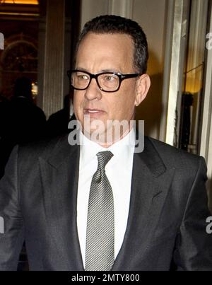 Actor Tom Hanks looks dapper in a black suit as he leaves his luxury hotel. Hanks did his best to keep a low profile as he left, turning away from autograph seekers and photographers. London, UK. 6/6/11. Stock Photo