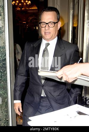 Actor Tom Hanks looks dapper in a black suit as he leaves his luxury hotel. Hanks did his best to keep a low profile as he left, turning away from autograph seekers and photographers. London, UK. 6/6/11. Stock Photo