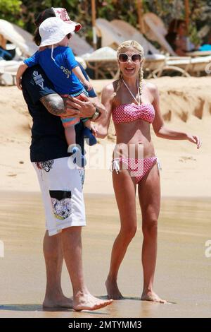 Actress and reality tv show star Tori Spelling looks painfully thin in a bikini whilst vacationing in Hawaii with husband Dean McDermott and son Liam.  Hawaii 6/16/09 Stock Photo