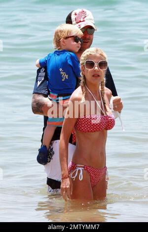 Actress and reality tv show star Tori Spelling looks painfully thin in a bikini whilst vacationing in Hawaii with husband Dean McDermott and son Liam.  Hawaii 6/16/09 . Stock Photo