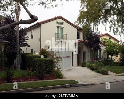 Exclusive!! This is Tori Spelling and Dean McDermott's new house in Los Angeles. The couple reportedly paid $2,275,000 for the 3,300-square-foot home that features 5 bedrooms and 3.5 bathrooms. The custom-built home features a large living room, formal dining room and gourmet kitchen with granite counter tops and stainless stell appliances. Other amenities include stained oak floors on the main level, a master suite with dual closets and city views and a lushly landscaped back yeard with saltwater pool, built0in BBQ and a covered eating area. It is situated in a quiet family-oriented neighborh Stock Photo