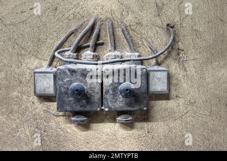 Detail of the old dirty switches on the wall Stock Photo