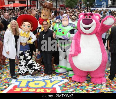 Producer Darla K. Anderson and 'Toy Story 3' director Lee Unkrich walk the multicolor carpet at Empire Leicester Square for the UK premiere of Disney and Pixar's 'Toy Story 3'.  The third installment in the Toy Story series has so far received positive reviews since its June release in North America and has proved popular in the toy and video game world with Mattel, Wii, Xbox 360 and PS3 all creating products based on the lovable film characters. London, UK. 07/18/10.   . Stock Photo