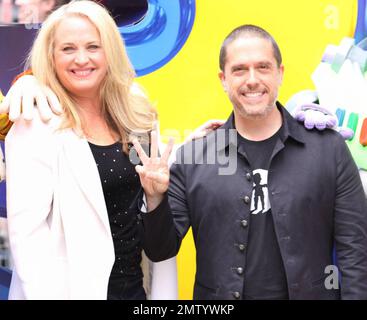 Producer Darla K. Anderson and 'Toy Story 3' director Lee Unkrich walk the multicolor carpet at Empire Leicester Square for the UK premiere of Disney and Pixar's 'Toy Story 3'.  The third installment in the Toy Story series has so far received positive reviews since its June release in North America and has proved popular in the toy and video game world with Mattel, Wii, Xbox 360 and PS3 all creating products based on the lovable film characters. London, UK. 07/18/10.    . Stock Photo