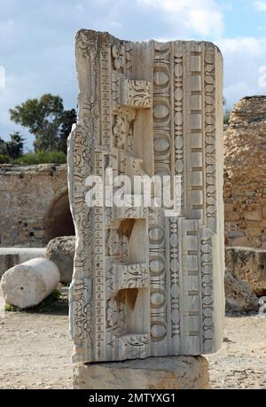 Carved stone at the Baths of Carthage in Tunisia Stock Photo