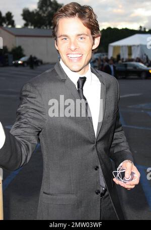 James Marsden signs autographs and holds his iPod as he arrives at Hollywood Palladium to attend 'The Trevor Live: An Evening Benefiting The Trevor Project'.  The Trevor Project aims to give youth nationwide 'life-saving and life-affirming resources' including a 24-hour hotline and a digital community to help reduce youth suicide. Los Angeles, CA. 12/05/10. Stock Photo