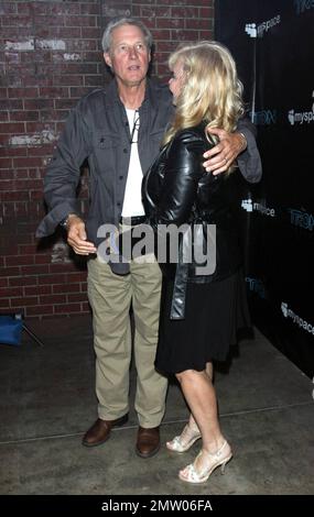 Bruce Boxleitner and Cindy Morgan arrive at the San Diego Convention Center for Disney's 'TRON: Legacy' party, hosted by MySpace, during Comic-Con 2010.  The party, dubbed 'Comi-Tron', was held inside a recreation of 'FlynnÕs Arcade' from the film and showcased a new trailer and 3D footage of the sci-fi sequel.  'TRON: Legacy' director Joseph Kosinski has been quoted as saying, 'Comic-conÕs kind of a comfortable place for us to be because thatÕs where we showed up two years ago with that little VFX demo we did, testing the waters and seeing if anyone was interested in this movie at all. In fac Stock Photo