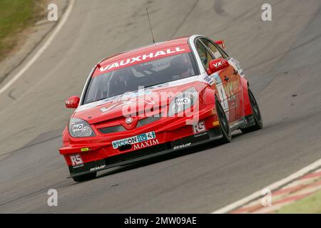 Fabrizio Giovanardi racing in his Vauxhall Vectra for team VX racing in the 2008 British Touring car championship at Brands Hatch on the limit going through Paddock hill bend. Stock Photo
