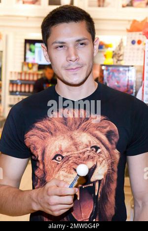 Alex Meraz of the 'Twilight' series, also dubbed The Wolf Pack, pose with lollipops for photographers and collect candy during their stop at The Sugar Factory Candy Store. Las Vegas, NV. 09/04/10. Stock Photo