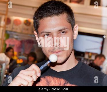 Alex Meraz of the 'Twilight' series, also dubbed The Wolf Pack, pose with lollipops for photographers and collect candy during their stop at The Sugar Factory Candy Store. Las Vegas, NV. 09/04/10. Stock Photo