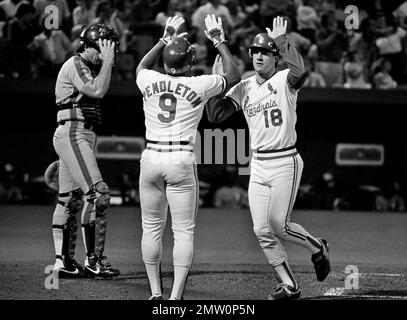 St Louis Cardinals Andy Van Slyke, right, pours champagne over teammate  Tito Landrum in the team locker room after defeating the Los Angeles  Dodgers for the National League Pennant in Los Angeles