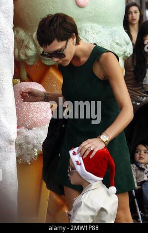 Victoria Beckham takes Romeo for a shopping spree at the Grove and  Maxfields. Victoria was wearing a retro style mini dress while her son  sported an LA Lakers outfit. Los Angeles, Ca.