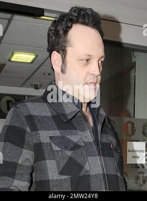 New father Vince Vaughn signs autographs for fans as he arrives and later leaves the studios of BBC Radio where he promoted his new movie 'The Dilemma', co-starring Jennifer Connelly and Winona Ryder.  Vaughn, whose daughter Locklyn Kyla Vaughn turned one month old yesterday, appeared happy to greet his fans despite looking a little tired.  Winona Ryder has said of Vaughn, 'I describe Vince as this volcano of energy and great ideas and so generous. He will come up with a great line and he will be like, 'Hey you should say that.'Ê It was such fun working with him, most of my scenes were with hi Stock Photo