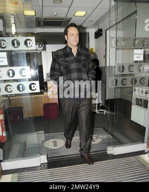New father Vince Vaughn signs autographs for fans as he arrives and later leaves the studios of BBC Radio where he promoted his new movie 'The Dilemma', co-starring Jennifer Connelly and Winona Ryder.  Vaughn, whose daughter Locklyn Kyla Vaughn turned one month old yesterday, appeared happy to greet his fans despite looking a little tired.  Winona Ryder has said of Vaughn, 'I describe Vince as this volcano of energy and great ideas and so generous. He will come up with a great line and he will be like, 'Hey you should say that.'Ê It was such fun working with him, most of my scenes were with hi Stock Photo