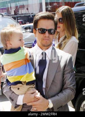 Mark Wahlberg carries son Brendan and wife Rhea Durham walks behind as they arrive at Hollywood Boulevard where Wahlberg received a star on the Hollywood Walk of Fame. The actor and producer was joined by his wife and their four children Ella Rae, Michael, Brendan and Grace.  Los Angeles, CA. 07/29/10. Stock Photo