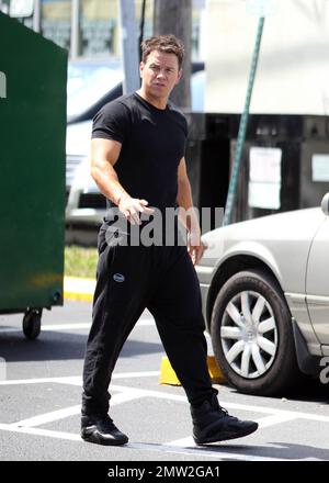 Mark Wahlberg films scenes on the set of his new movie 'Pain and Gain' on the streets of Miami, FL. 16th April 2012. Stock Photo