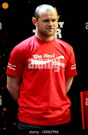 English footballer Wayne Rooney of Manchester United at a photocall with the World Cup trophy at Earls court.  The 2010 World Cup will kick off in South Africa this June. London, UK. 03/11/10.    . Stock Photo