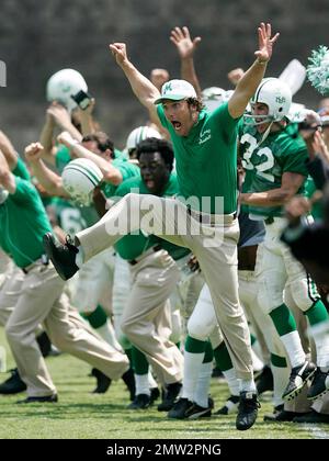 Exclusive!! Actors Anthony Mackie, left, portraying Nate Ruffin and Matthew McConaughey, center, portraying Marshall coach Jack Lengyel, celebrate the Young Thundering Herd's victory against Xavier on Saturday, June 10, 2006, during the filming of 'We Are Marshall' at Herndon Stadium at Morris Brown College in Atlanta, Ga. The movie depicts the fight to maintain Marshall's football program following the 1970 plane crash that claimed 75 lives including Marshall football players, coaches, community members and flight crew. Stock Photo