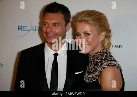 Ryan Seacrest and girlfriend Julianne Hough pose for photographers at The Weinstein Company and Relativity Media's 2011 Golden Globe After Party following the 68th Annual Golden Globe Awards held at The Beverly Hilton hotel. Los Angeles, CA. 01/16/11. Stock Photo