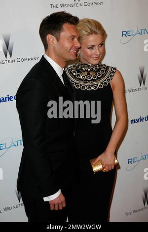 Ryan Seacrest and girlfriend Julianne Hough pose for photographers at The Weinstein Company and Relativity Media's 2011 Golden Globe After Party following the 68th Annual Golden Globe Awards held at The Beverly Hilton hotel. Los Angeles, CA. 01/16/11. Stock Photo