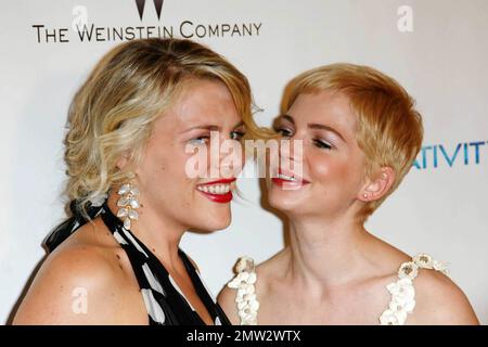 Busy Philipps and Michelle Williams pose for photographers at The Weinstein Company and Relativity Media's 2011 Golden Globe After Party following the 68th Annual Golden Globe Awards held at The Beverly Hilton hotel. Los Angeles, CA. 01/16/11. Stock Photo
