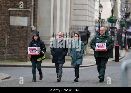 LONDON, 1st February 2023, Paul Nowak General Secretary of the TUC (second left), is joined by a representative of the Fire Brigades Union and the NHS Ambulance Service as they hand in a mass petition against the government's plans to introduce a new law on minimum service levels during strikes. Stock Photo